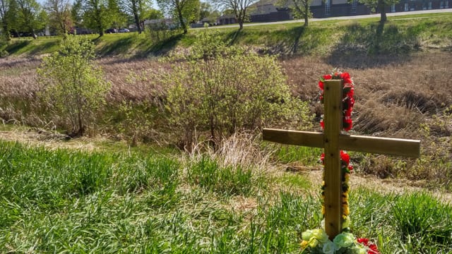 A cross marks the spot where Tammy Keeash is said to have been with friends the night she died last month. Her body was found just below in the Neebing McIntyre floodway where police say the 17-year-old drowned.