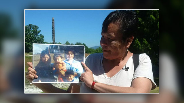Marlene Jack holds a picture of her sister Doreen's family.