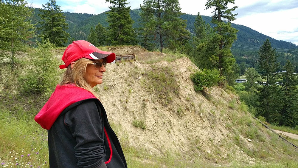 Jane Aubertin looks out over a ridge during a search in July 2018. Photo: Holly Moore/APTN