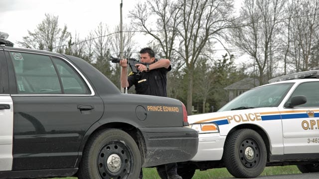 A member of the Ontario Provincial Police takes aim at the Mohawk blockade in 2008.