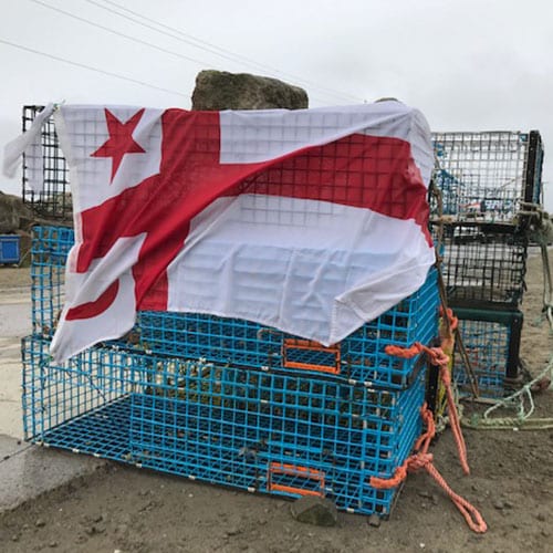 Mi’kmaw flag over lobster cages