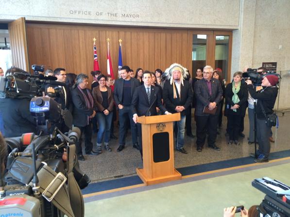 Winnipeg Mayor Brian Bowman stands at podium during press conference Thursday.