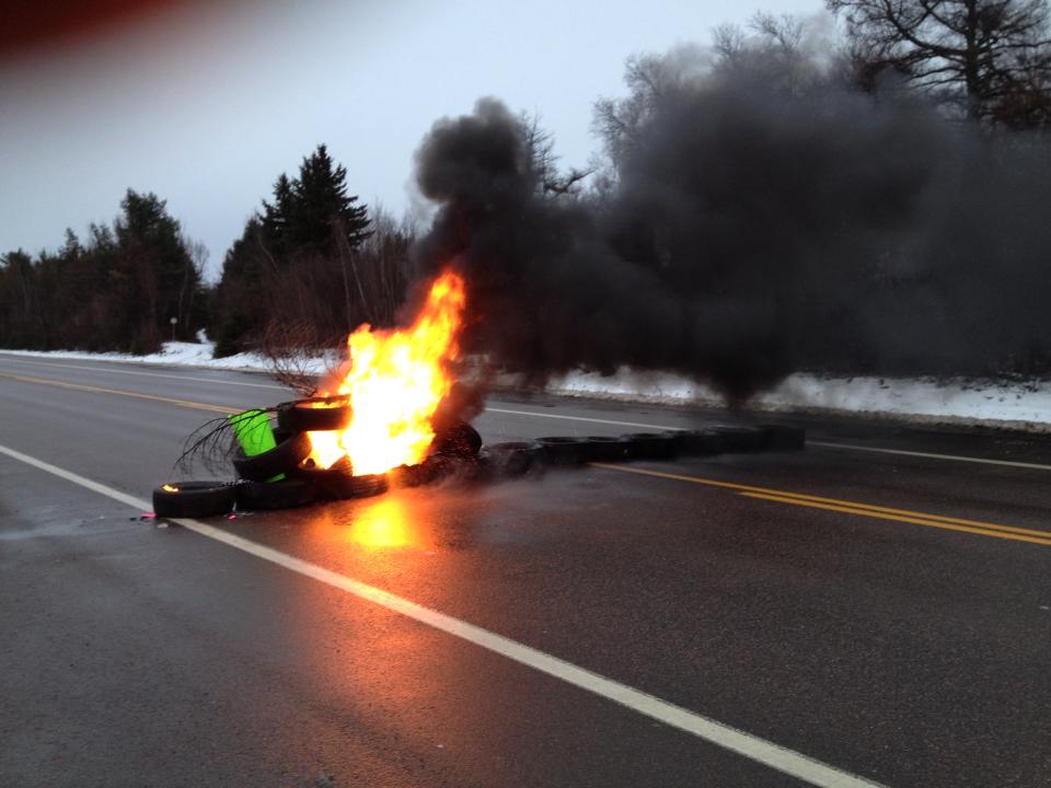 Tires set alight on Hwy 11.