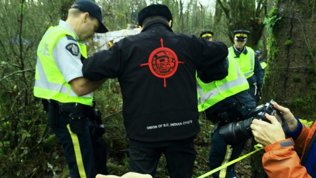 Gand Chief Stewart Phillip arrested on Burnaby Mountain on Nov. 27, 2014, during protest against Trans Mountain pipeline. Farrah Merali/Twitter