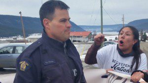 Kanahus Manuel confronts an RCMP officer during an anti-treaty vote demonstration Thursday on the Williams Lake Indian Band reserve in British Columbia's interior. Facebook photo.