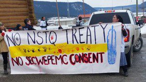 A banner is unfurled during an anti-treaty vote protest on the Williams Lake Indian Band reserve Thursday.